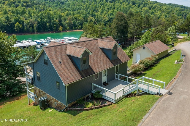 bird's eye view featuring a water view and a wooded view