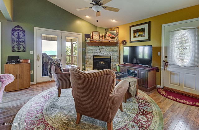 954 Pawnee Ct, Sevierville, TN 37876 - living area featuring plenty of natural light, vaulted ceiling, french doors, and light wood-style flooring
