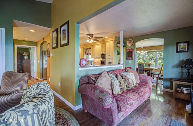 954 Pawnee Ct, Sevierville, TN 37876 - living area featuring a ceiling fan, arched walkways, and hardwood / wood-style flooring