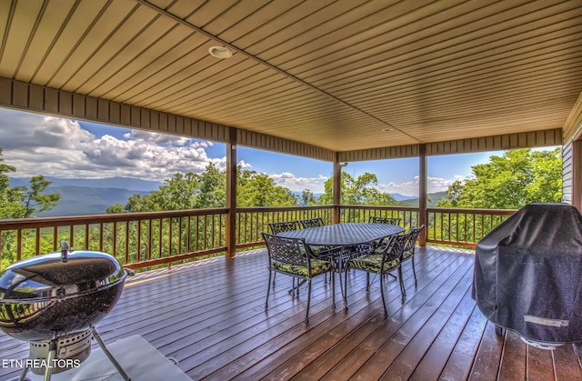 954 Pawnee Ct, Sevierville, TN 37876 - wooden terrace featuring a mountain view, outdoor dining space, and grilling area