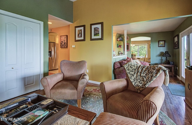954 Pawnee Ct, Sevierville, TN 37876 - living room with wood finished floors, baseboards, and arched walkways