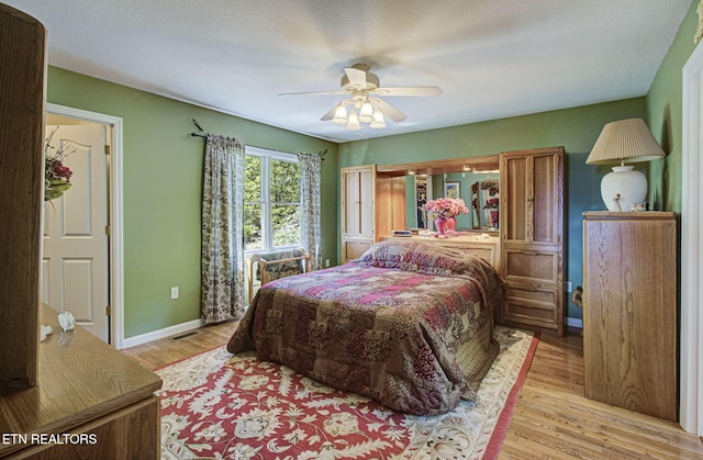 954 Pawnee Ct, Sevierville, TN 37876 - bedroom with baseboards, light wood-style flooring, visible vents, and a ceiling fan