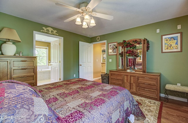 954 Pawnee Ct, Sevierville, TN 37876 - bedroom with ensuite bathroom, baseboards, a ceiling fan, and wood finished floors