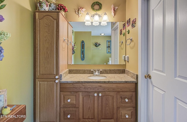 954 Pawnee Ct, Sevierville, TN 37876 - bathroom featuring an inviting chandelier and vanity