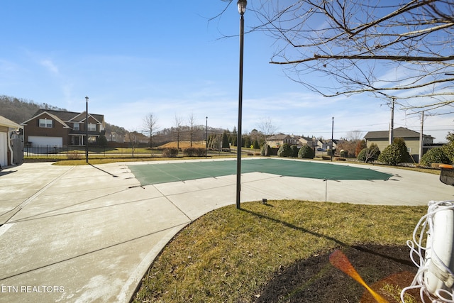 view of pool with a fenced in pool, a yard, a patio area, and fence