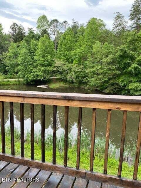 wooden terrace with a water view