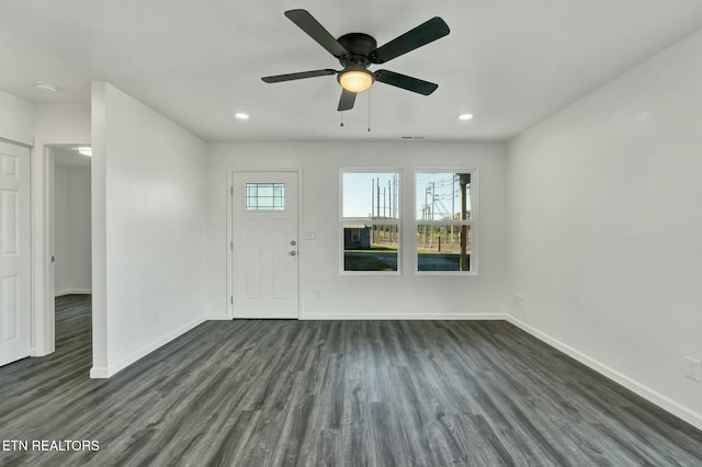 entryway with plenty of natural light, baseboards, and dark wood finished floors