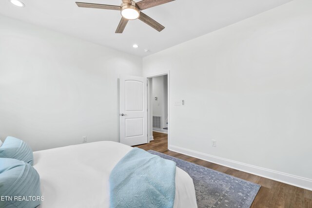 bedroom with baseboards, visible vents, recessed lighting, and dark wood finished floors