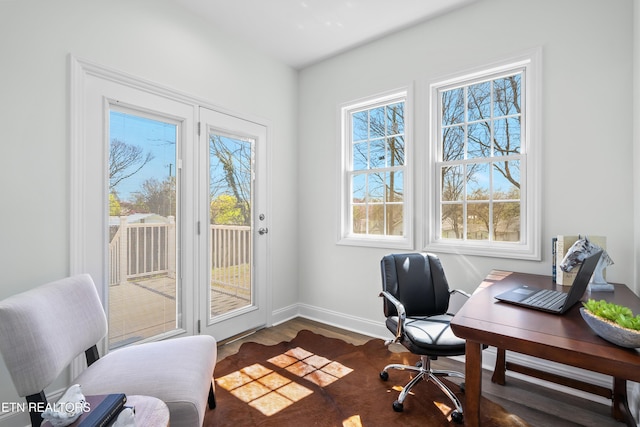 office space with baseboards and dark wood-style flooring