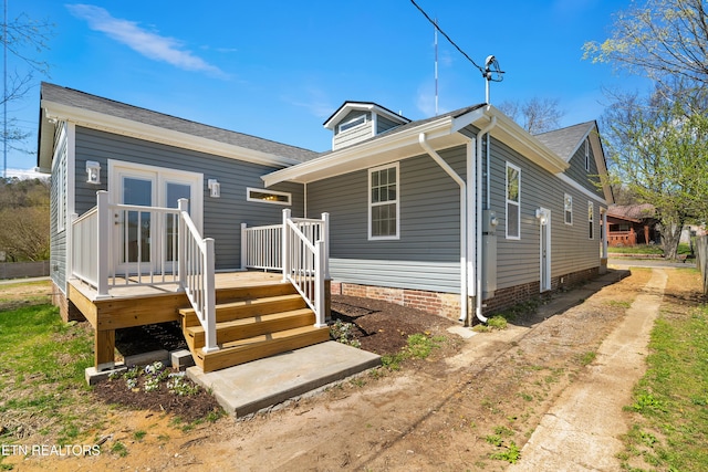 view of front of property featuring a wooden deck