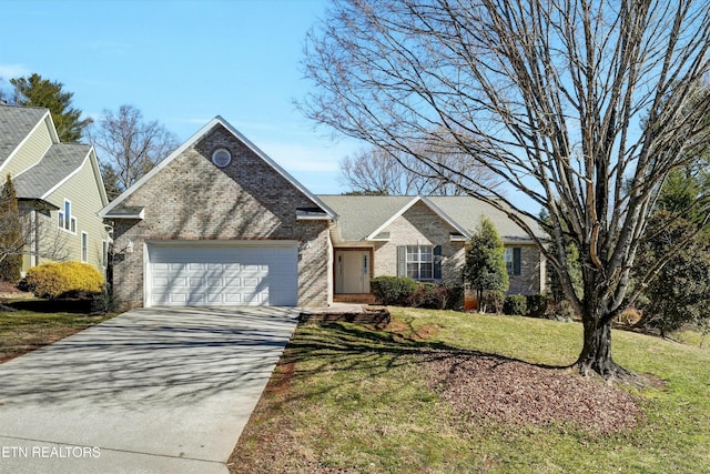 view of front of home with a front yard, brick siding, driveway, and an attached garage