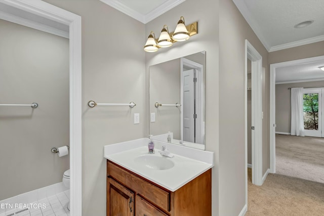 bathroom featuring toilet, baseboards, ornamental molding, and vanity