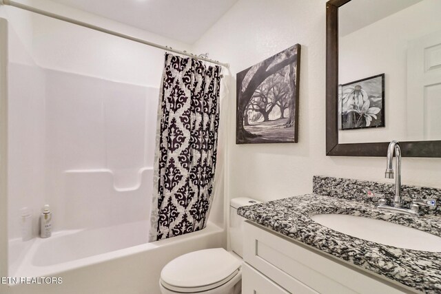 full bathroom with vanity, toilet, and shower / bath combo