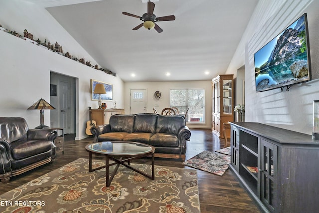 living room with dark wood-type flooring, recessed lighting, a ceiling fan, and vaulted ceiling