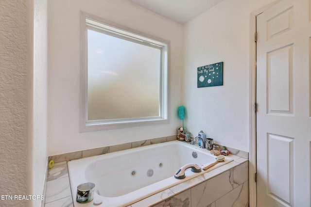 bathroom featuring a whirlpool tub