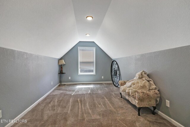 bonus room with vaulted ceiling, carpet, and baseboards