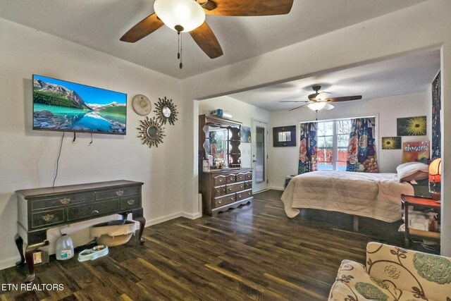 bedroom with ceiling fan, baseboards, and dark wood-style floors