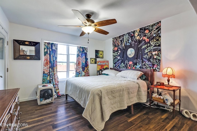 bedroom featuring wood finished floors, baseboards, and ceiling fan