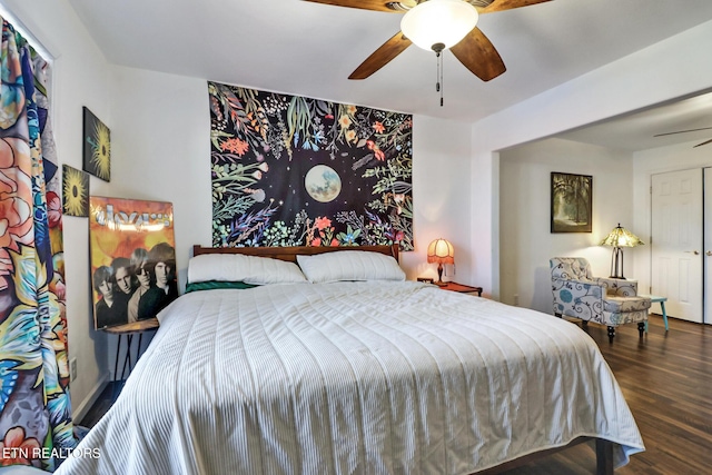 bedroom with wood finished floors and a ceiling fan