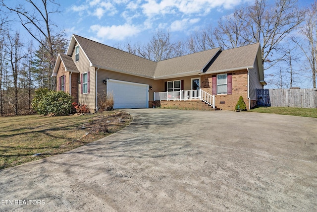 ranch-style house featuring an attached garage, fence, roof with shingles, crawl space, and driveway