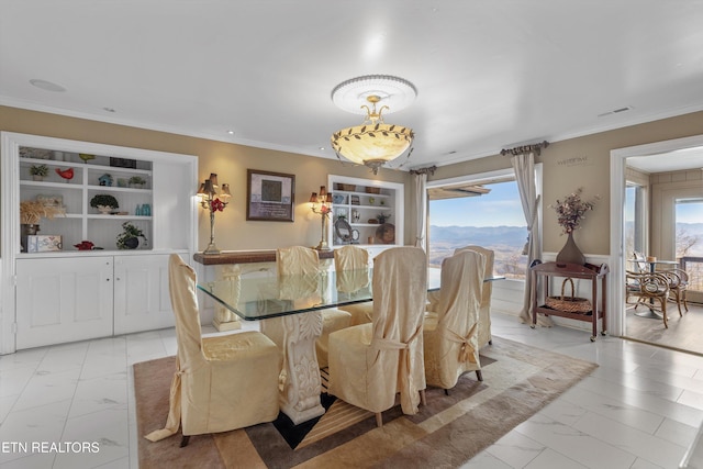 dining area featuring marble finish floor, visible vents, and ornamental molding