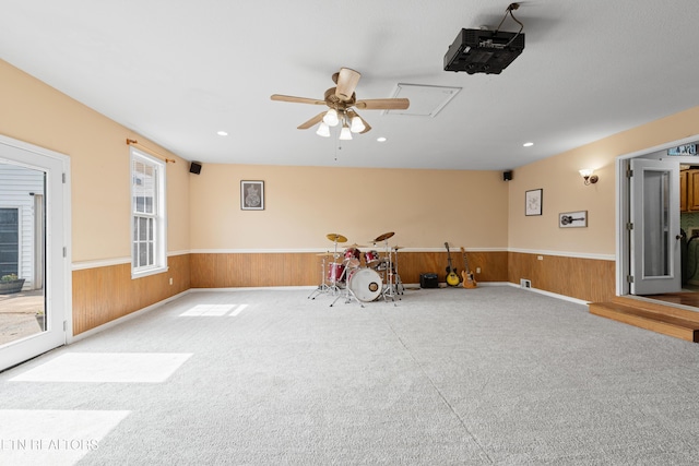 game room with a wainscoted wall, ceiling fan, recessed lighting, and wooden walls