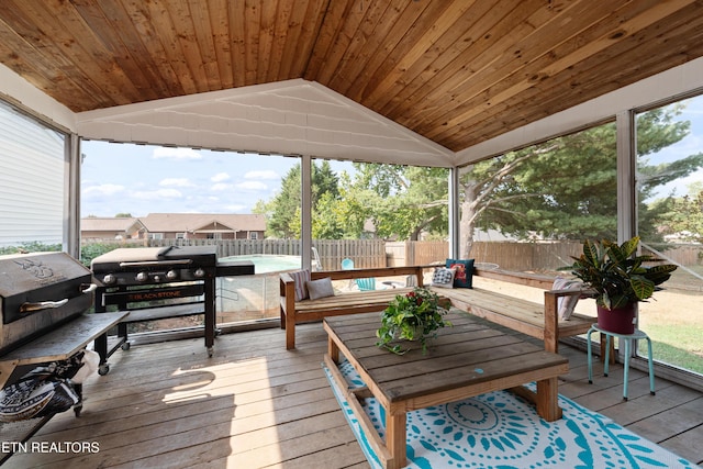 wooden terrace featuring grilling area and a fenced backyard