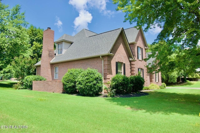 1689 Peppertree Dr, Alcoa, TN 37701 - view of side of property featuring a chimney, brick siding, a lawn, and a shingled roof