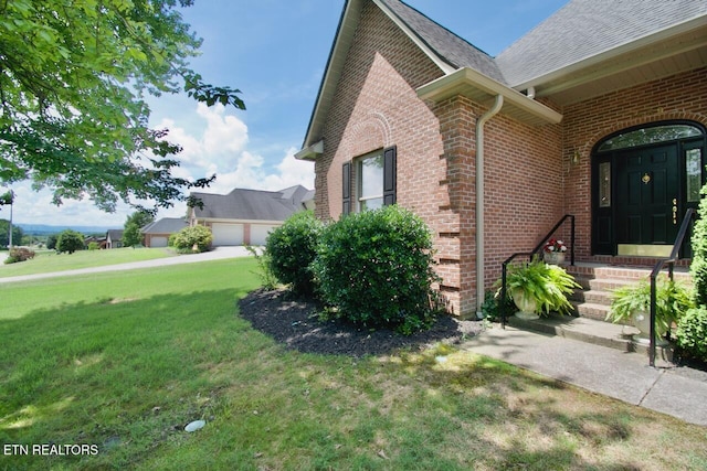 1689 Peppertree Dr, Alcoa, TN 37701 - view of side of home featuring a lawn and brick siding