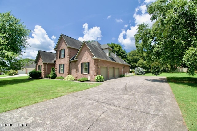 1689 Peppertree Dr, Alcoa, TN 37701 - traditional-style house with brick siding, an attached garage, a front lawn, and driveway