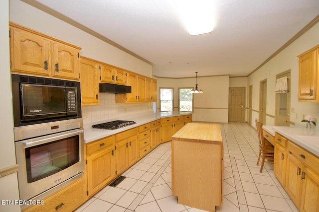 1689 Peppertree Dr, Alcoa, TN 37701 - kitchen featuring stainless steel appliances, crown molding, under cabinet range hood, butcher block counters, and tasteful backsplash