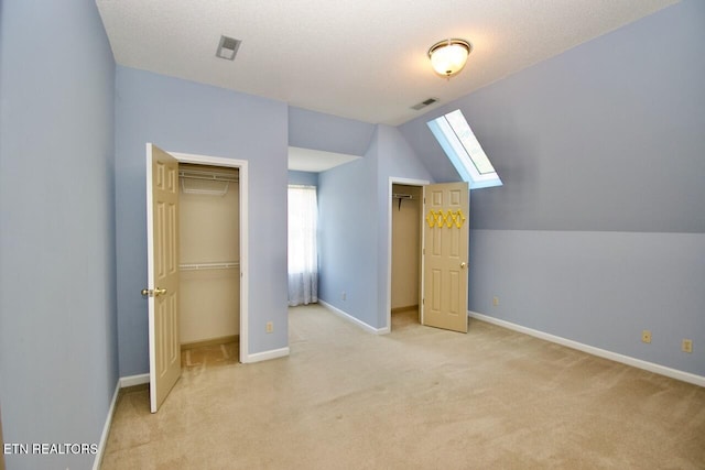 1689 Peppertree Dr, Alcoa, TN 37701 - unfurnished bedroom with a skylight, light carpet, vaulted ceiling, and a closet