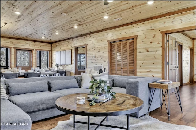 living area featuring recessed lighting, wood ceiling, wood walls, and wood finished floors