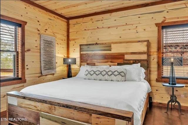 bedroom featuring wooden ceiling, wooden walls, and wood finished floors