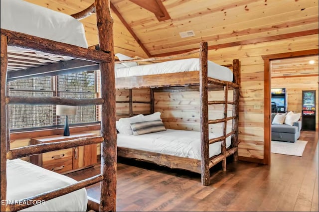 bedroom with vaulted ceiling, wood walls, wooden ceiling, and wood finished floors