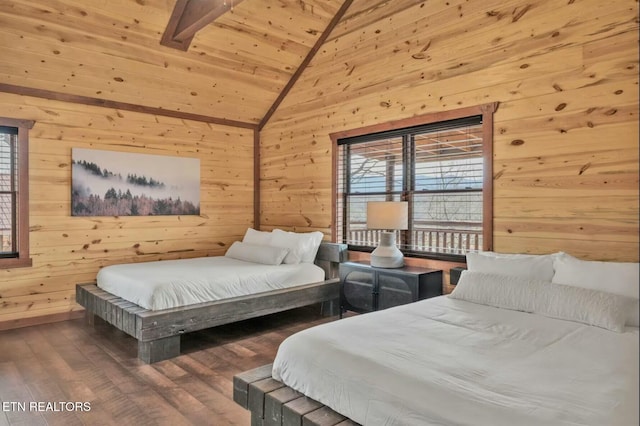 bedroom with wooden ceiling, wood finished floors, and wooden walls