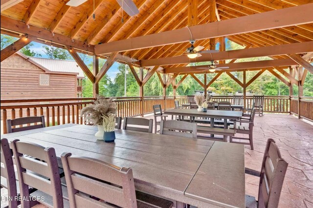 exterior space with outdoor dining area, ceiling fan, and a gazebo