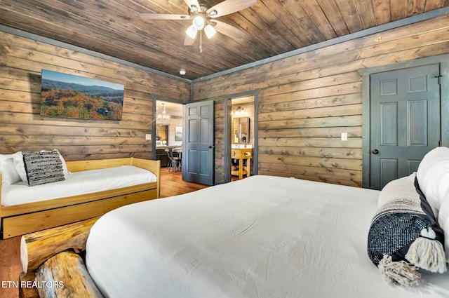 bedroom with ceiling fan and wood ceiling