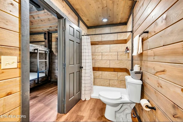 bathroom featuring wooden ceiling, a shower with shower curtain, wood walls, and toilet