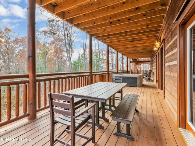 wooden terrace with outdoor dining space