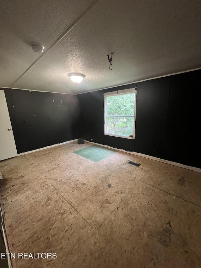 empty room with visible vents and a textured ceiling