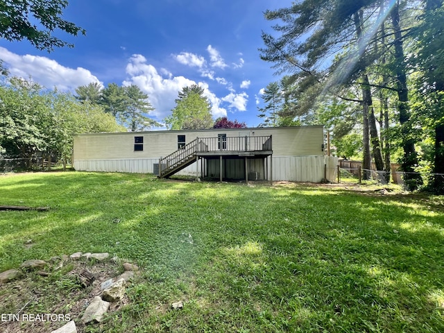 view of yard featuring stairway, fence, and a wooden deck