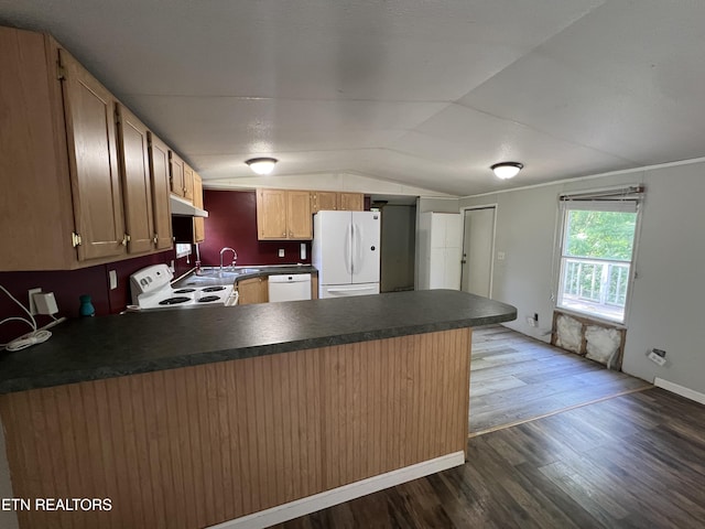 kitchen with white appliances, dark wood finished floors, dark countertops, lofted ceiling, and a peninsula