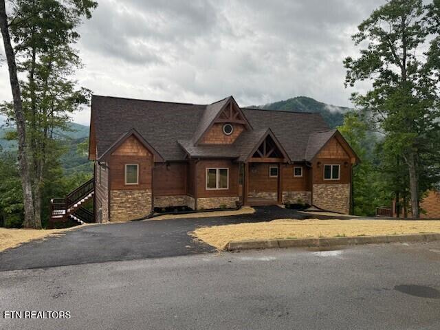1841 Pinestand Ridge Way, Sevierville, TN 37862 - view of front facade with stone siding and driveway