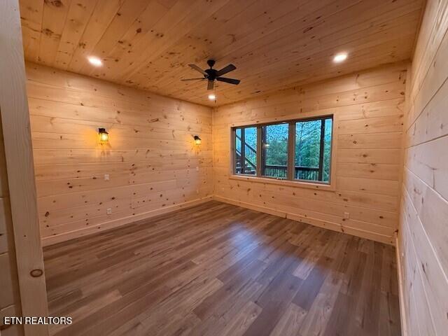 1841 Pinestand Ridge Way, Sevierville, TN 37862 - unfurnished room featuring wooden ceiling, a ceiling fan, wood finished floors, wood walls, and recessed lighting