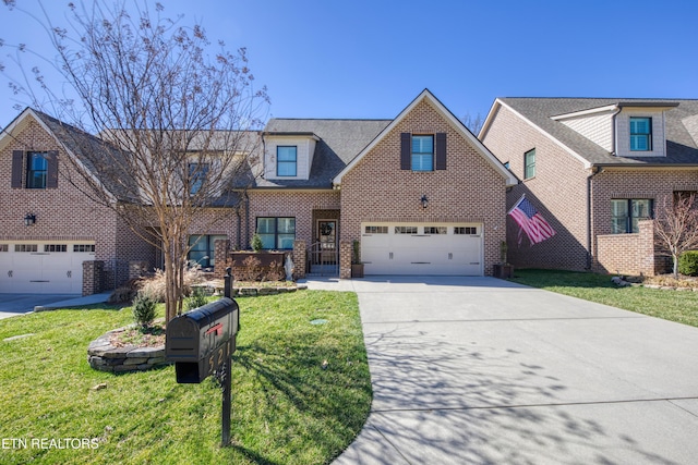 view of front facade featuring concrete driveway, brick siding, a front lawn, and an attached garage