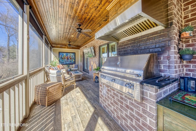 sunroom featuring wooden ceiling