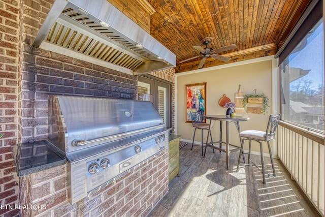 exterior space featuring grilling area and a ceiling fan