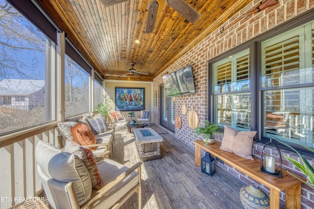 sunroom / solarium with wooden ceiling and ceiling fan