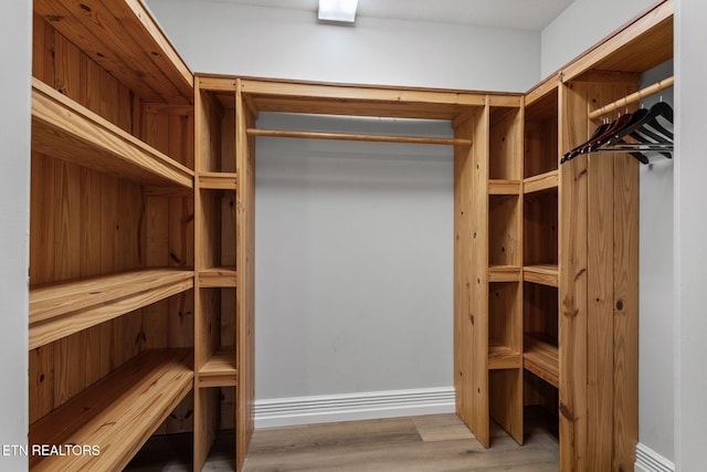 spacious closet with wood finished floors